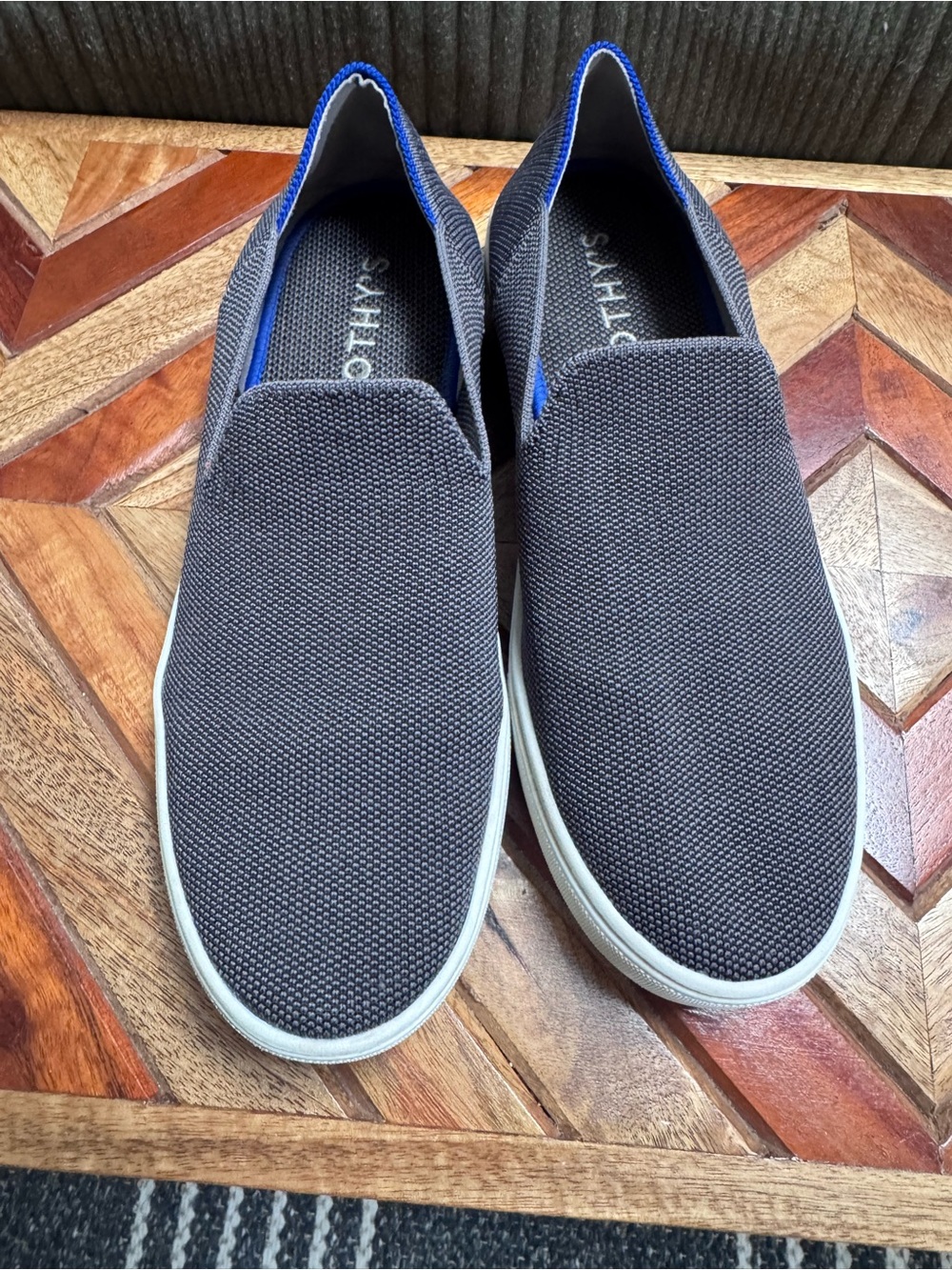 Rothy's Gray Slip-On Sneakers with Blue and White Stripe